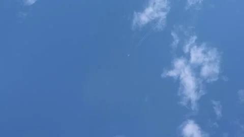 The plane flies in the sky with clouds Video stock 139485720