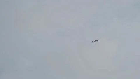 The plane flies in the sky in cloudy weather Stock Footage 162032668