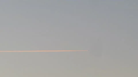 The plane flies in the sky leaving a trail of smoke Stock Footage 143609656