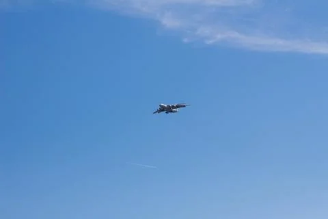 The plane flies in the sky Stock Photos