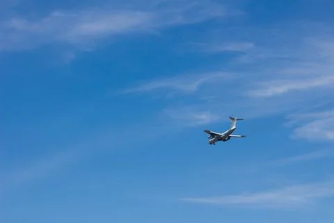 The plane flies in the sky Stock Photos