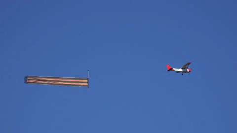 The plane flies in the sky with St. George's ribbon Stock Footage 95079565
