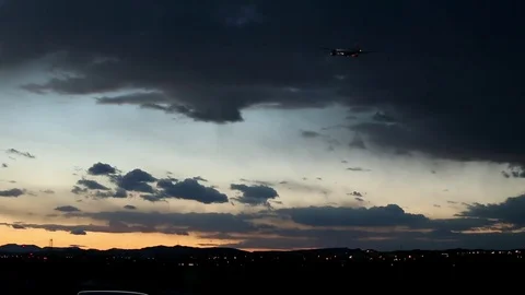 The plane flies at sunset Stock Footage 75217060