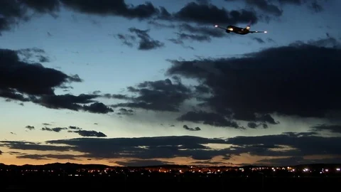 The plane flies at sunset Video stock 75217073