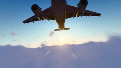 The plane flies through the clouds into the distance Vidéo 307974201