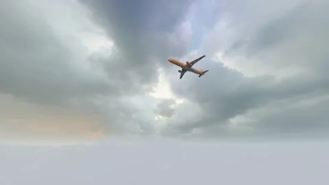 The plane flies through the clouds into the distance2 Stock Footage 288069386