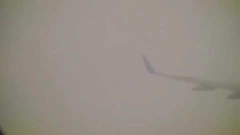 Plane flies through the white clouds in the afternoon Stock Footage 106201825