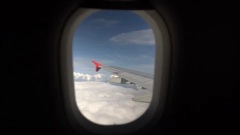 The plane flies in white clouds. View from the cabin on the wing Stock Footage 120687046
