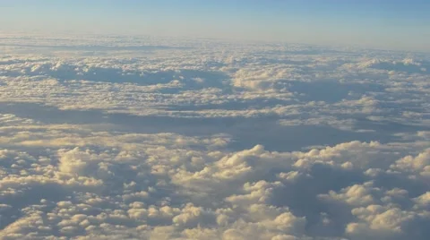 Plane Flight Above The Clouds with blue sky on background Stock Footage 64092296