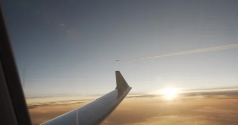Plane flight above the clouds. Red-orange sunset. Stock Footage 119006266
