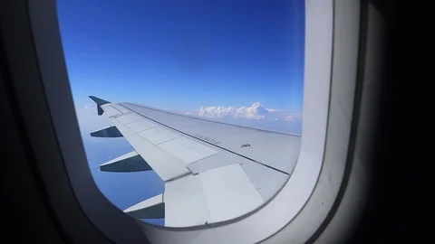 Plane flight above the clouds. View from window. 스톡 동영상 91851419