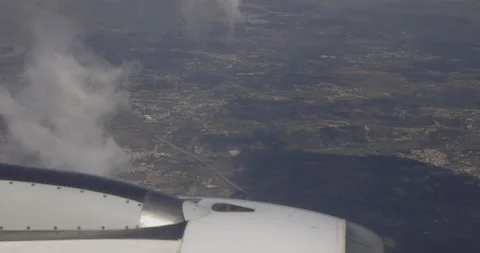 Plane flight, city below, 4K Stock Footage 221272111
