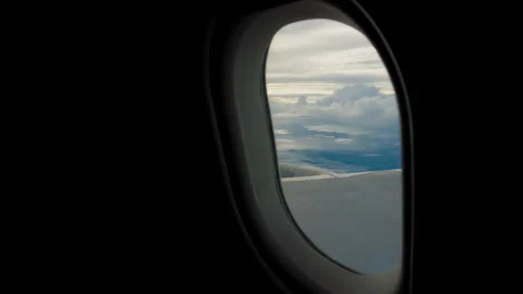 Plane In Flight Window POV 4K 스톡 동영상 210852828