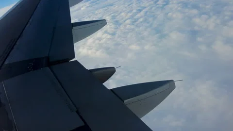 Plane In Flight Wing CU Clouds 4K 動画素材 210848132