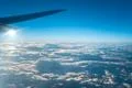 The plane fly on the background of beautiful cloud Photo