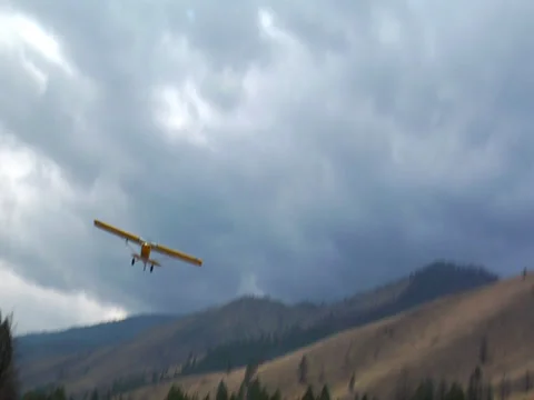 Plane fly over in Rocky Mountains Stock Footage 24652631