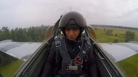 Plane fly quickly. Pilot fooling around and making hand gestures. Inside view. Stock Footage 118677940