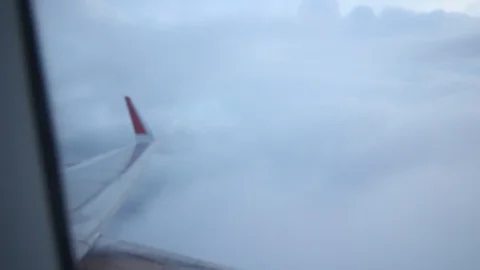 The plane fly on a stormy cloud, Taken picture from the plane window 動画素材 107634532