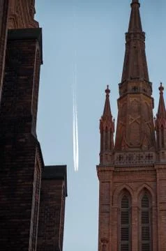 Plane flyiing between two buildings in Wiesbaden Germany Stock Photos