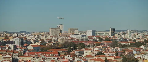 Plane is flying above the city Stock Footage 151354861