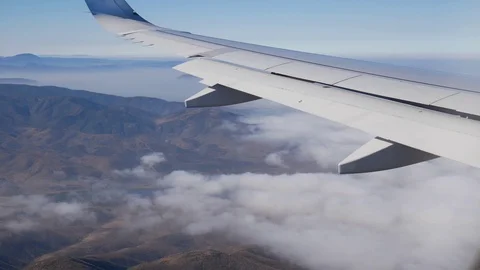 Plane Flying Above The Clouds Stock Footage 123624667