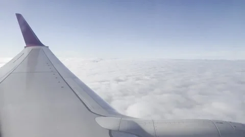 Plane Flying Above The Clouds Video stock 240215978
