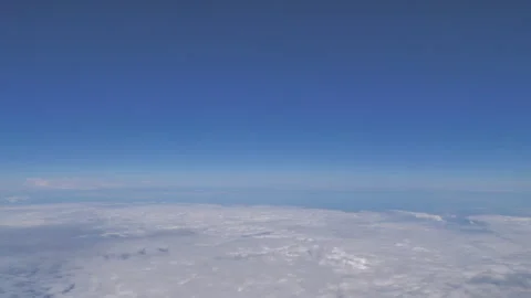 Plane flying above clouds Seq B Pt1 of 5 Stock Footage 240748577