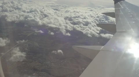 Plane Flying Above Clouds - Wing Rear View Stock Footage 58926518