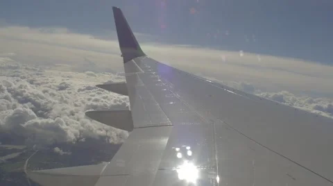 Plane Flying Above Clouds - Wing View Stock Footage 58926528