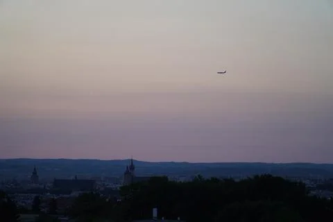 Plane flying after sunset Stock Photos