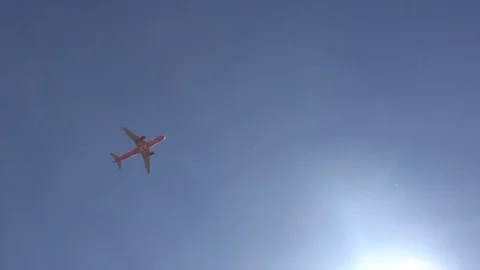 The plane is flying against the clouds. the plane is flying against the sky. Stock Footage 109583009