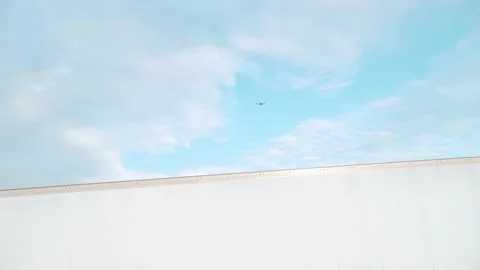 Plane flying in the air with a tractor trailer in the frame Video stock 212451172