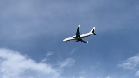 Plane flying in blue sky Stock Footage 337111292