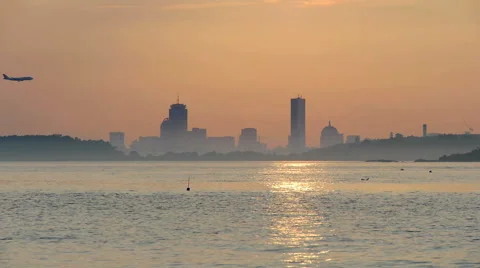 Plane Flying By Boston at Sunset Stock-Footage 40465708