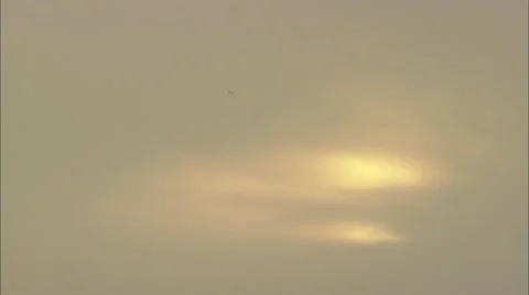 Plane flying in the distance Stock Footage 12761288