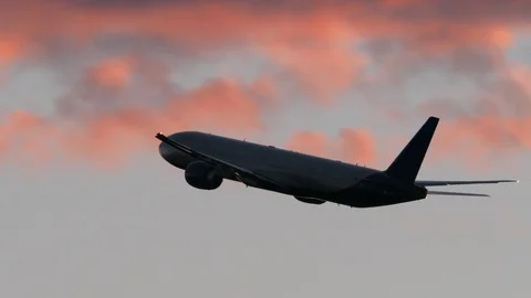 Plane flying in evening cloudy sky Stock-Footage 88467036