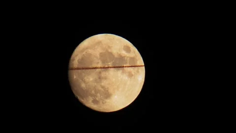 Plane Flying in Front of Moon with Exhaust Fumes Night Sky 4K Vertical Video 스톡 동영상 335898538
