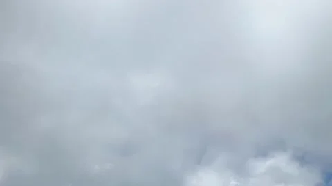 Plane flying to grey cloudy to appear blue sky view from window seat in airplane Stock Footage 218340011