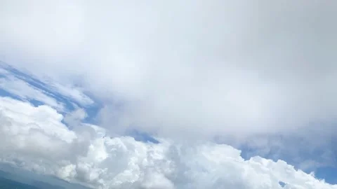 Plane flying to grey cloudy to appear blue sky view from window seat in airplane Stock Footage 218340013