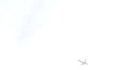 A plane flying high in the grey sky  Stock Footage 274899432