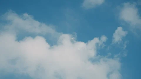 Plane flying high. Jet moving through fluffy clouds. Small aircraft drifts Stock-Footage 330156407