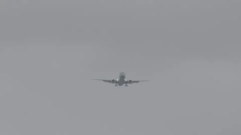 Plane Flying Low to Land Stock Footage 154004774