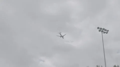 Plane Flying Low to Land Stock Footage 154005188