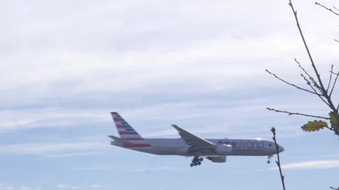 Plane Flying Low Through Frame On Landing Approach Video stock 149155715