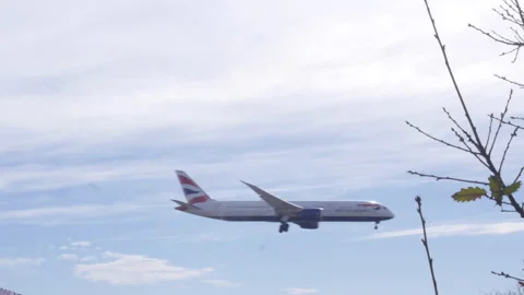 Plane Flying Low Through Frame On Landing Approach Video stock 149155765