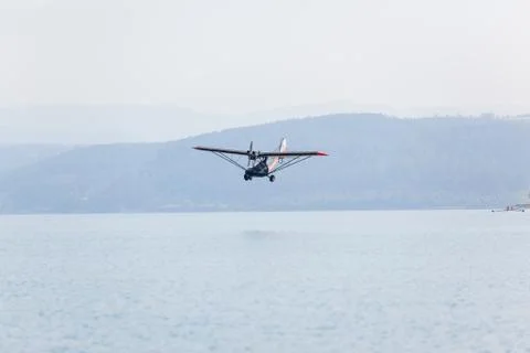 Plane Flying Low Waters Stock Photos
