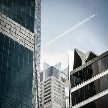 Plane flying over CBD Stock Photos