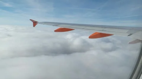 Plane flying over clouds Stock Footage 10734960