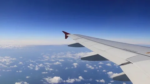 Plane flying over clouds Video stock 84653079