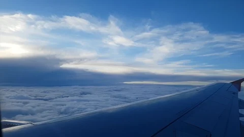 Plane flying over clouds 動画素材 85680589